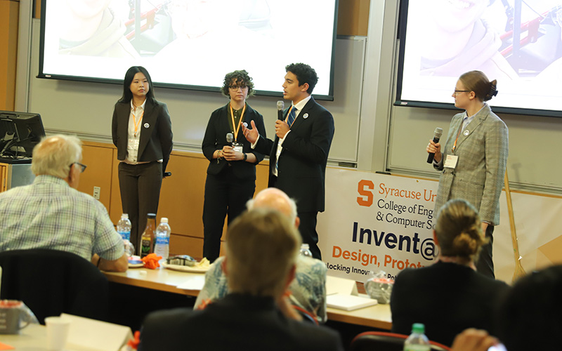 Invent@SU Students describing their invention to a panel of judges