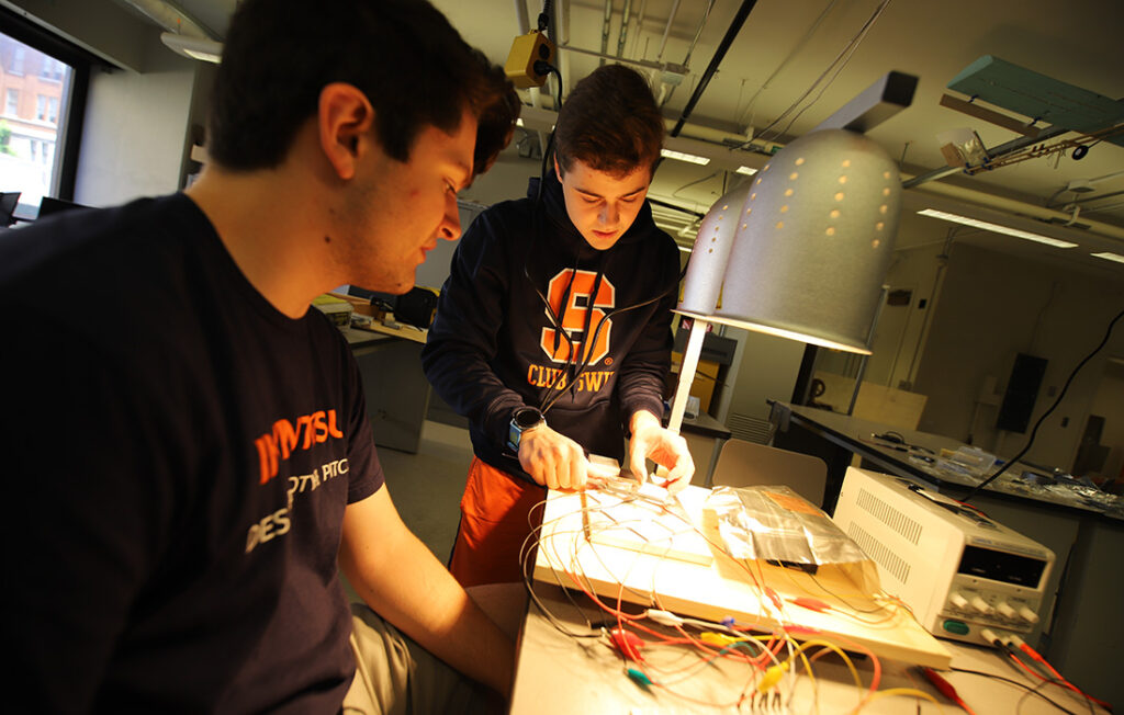 Ian Storrs and Brendan Murty working on an invention