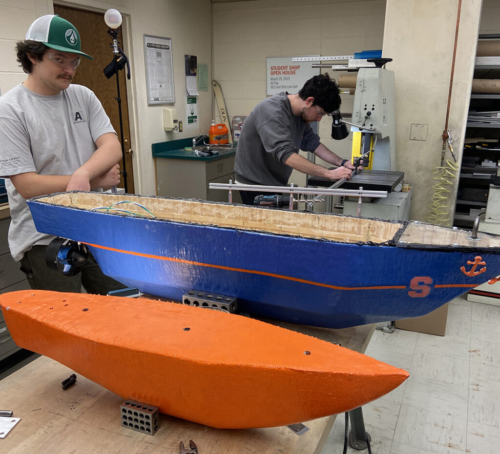 Students building an electric boat