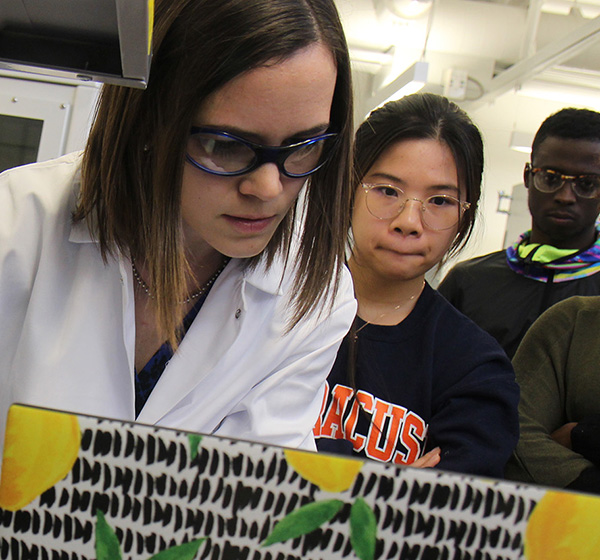 Professor Mary Beth Monroe with students in a lab