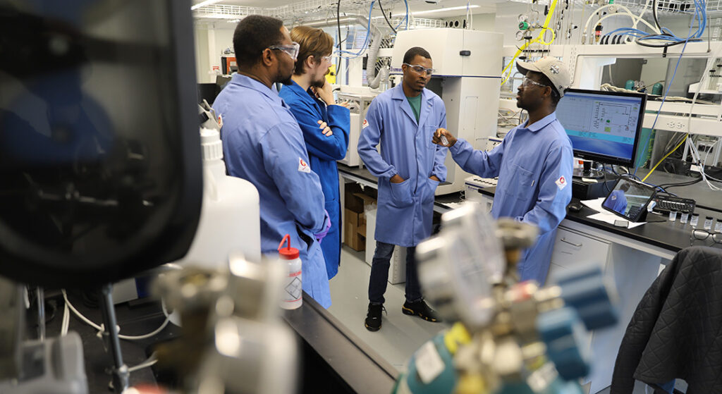 Professor Ted Walker with his research team in the lab