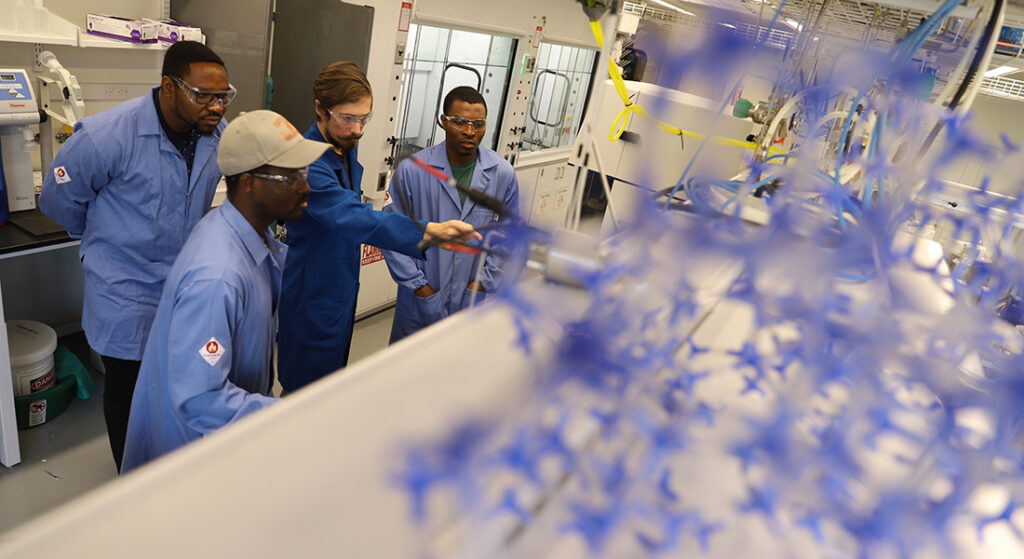 Professor Ted Walker with his research team in the lab