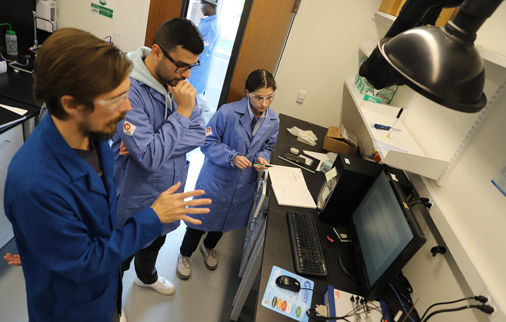 Professor Ted Walker with his research team in the lab