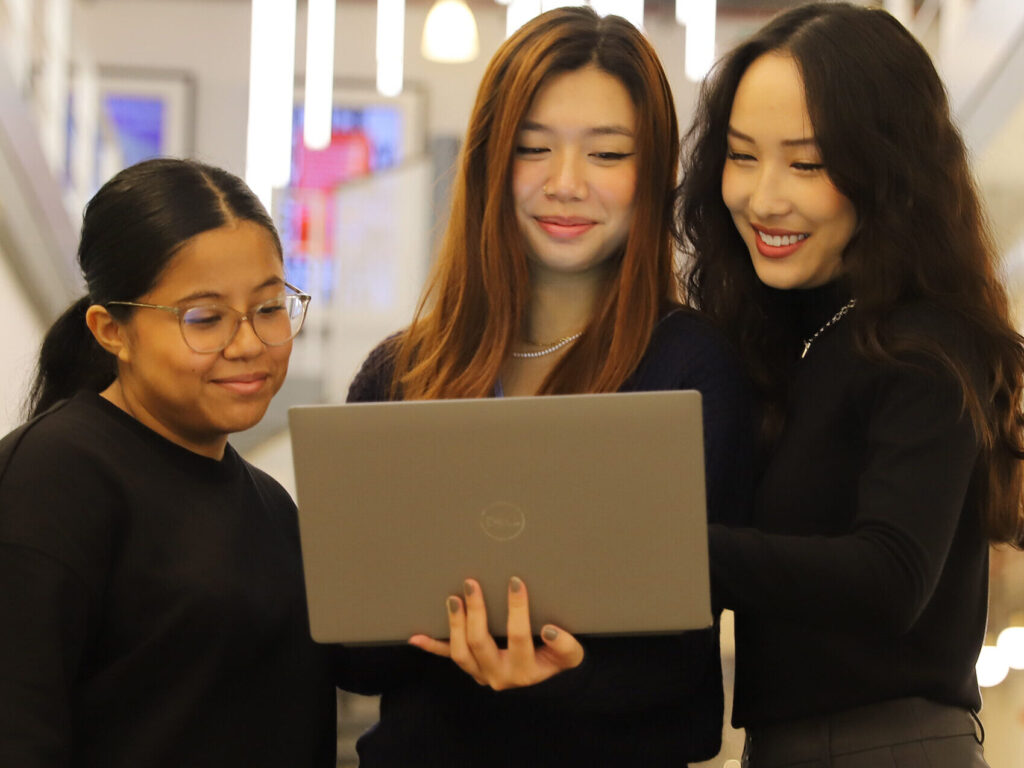 ECS Women looking at a laptop