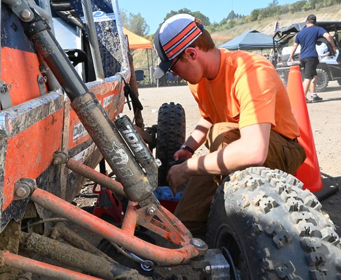 Student working on a Cuse Baja car