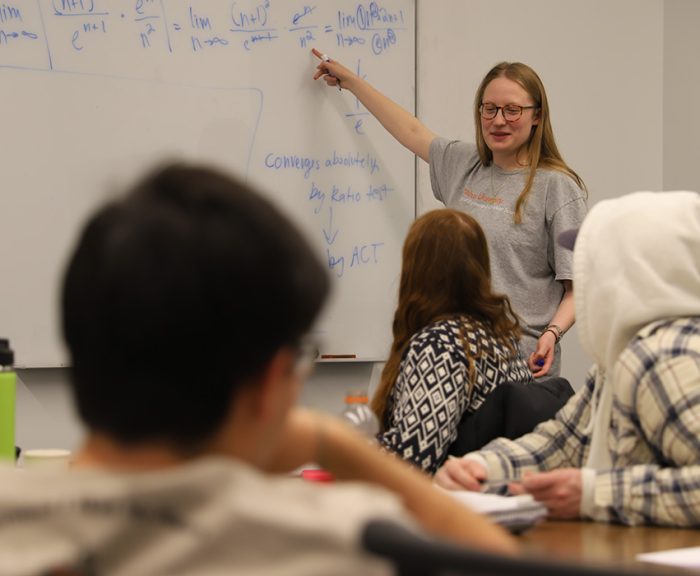 A student leading an academic excellence workshop
