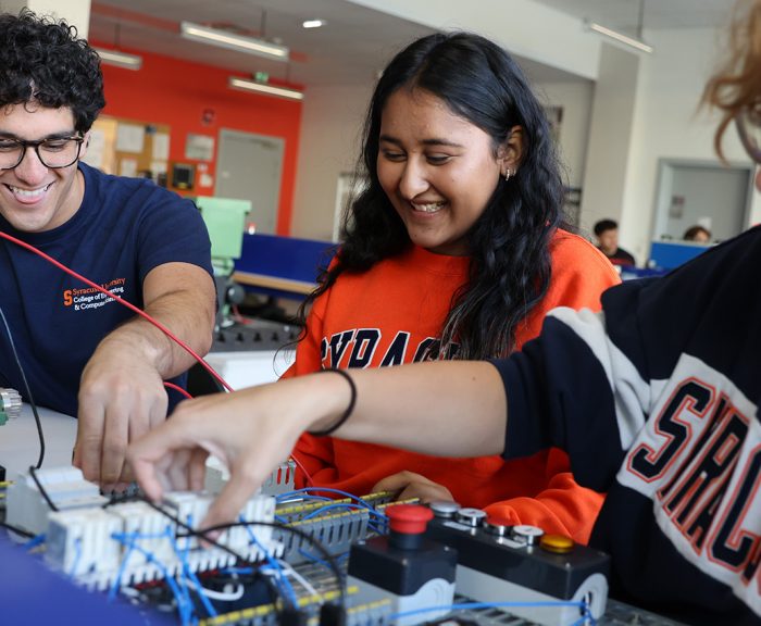 Three Students Working in an Electrical Engineering Lab in Strasbourg France