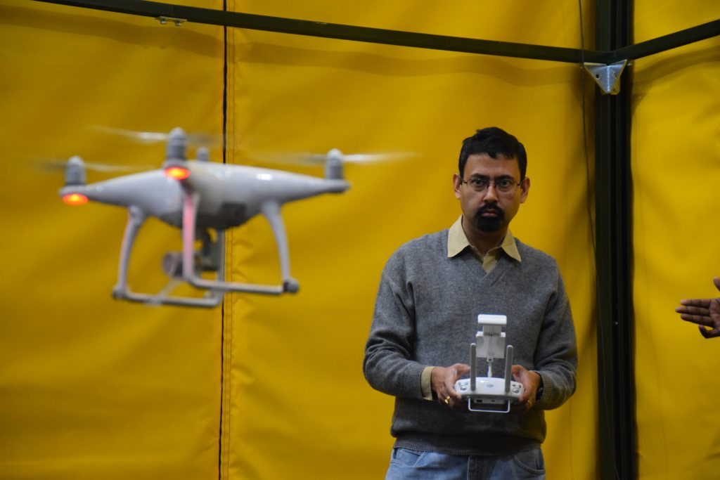 Professor Amit Sanyal testing an unmanned arial vehicle in a drone lab 