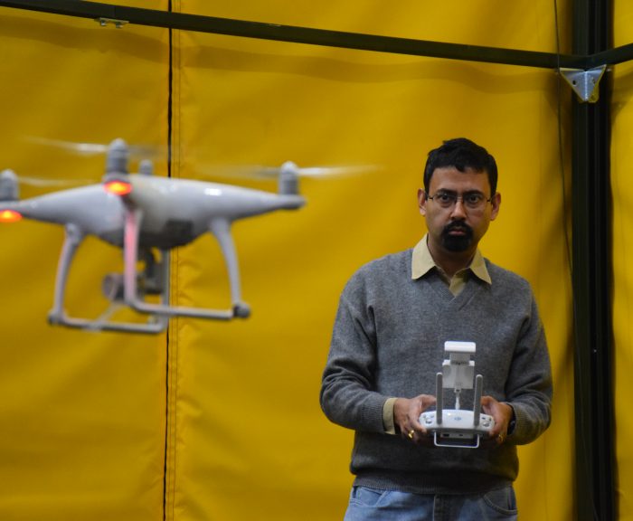 Professor Amit Sanyal testing an unmanned arial vehicle in a drone lab