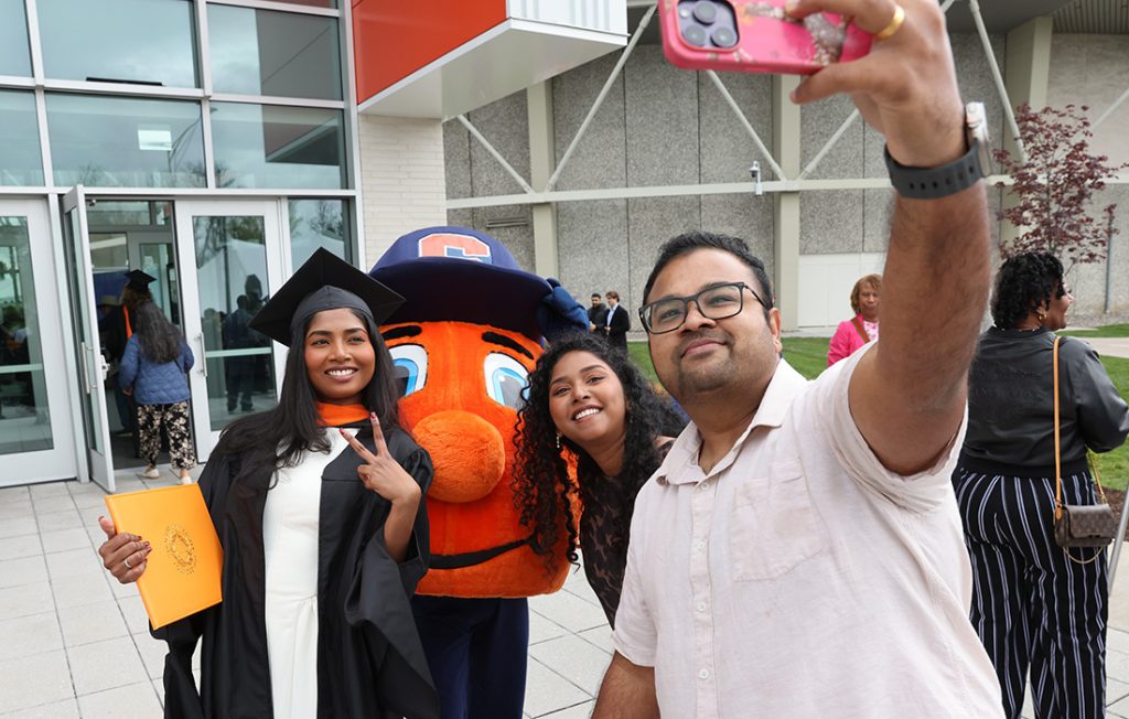 A family taking a selfie with Otto