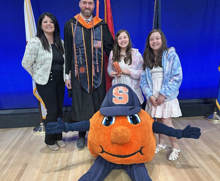 John Steele and his family with Otto the Orange