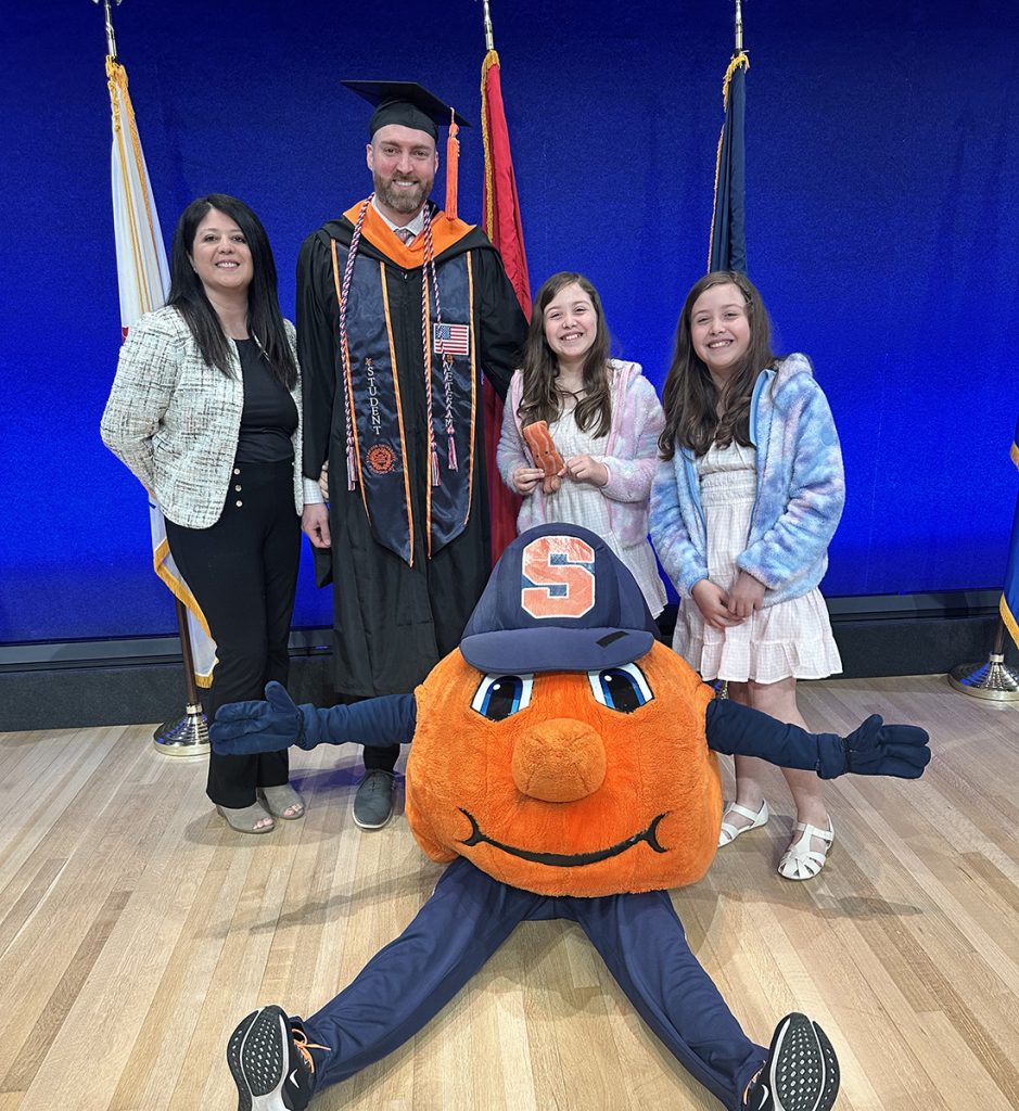John Steele and his family with Otto the Orange