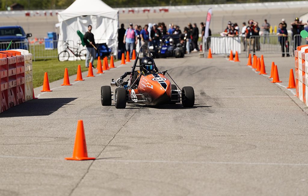 The Citrus Racing car making a turn at the Formula SAE event in Michigan