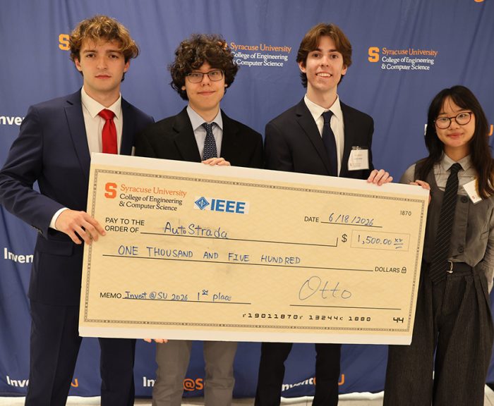 Team AutoStrada with a giant check after winning the 2026 Invent@SU session