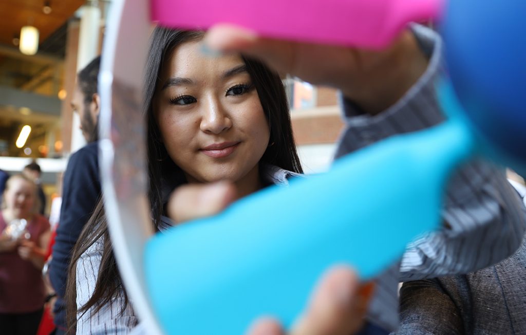 A mechanical and aerospace engineering capstone student student with fan blade