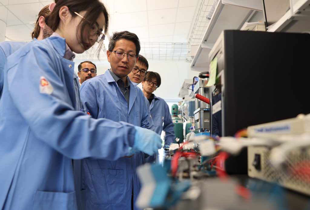Mechanical and Aerospace Engineering Professor Quinn Qiao and his research team working on battery related research