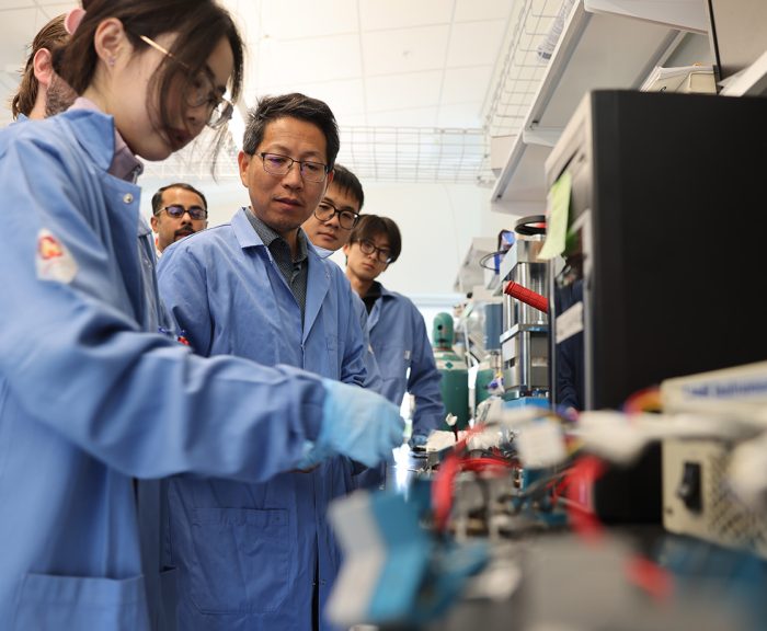 Mechanical and Aerospace Engineering Professor Quinn Qiao and his research team working on battery related research